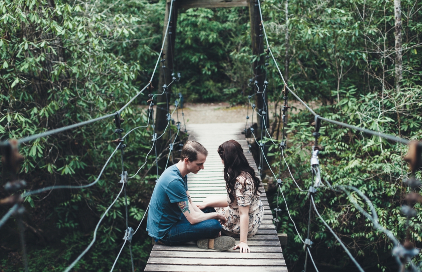 couple on swinging bridge in Blue Ridge Mountians near Brevard, NC